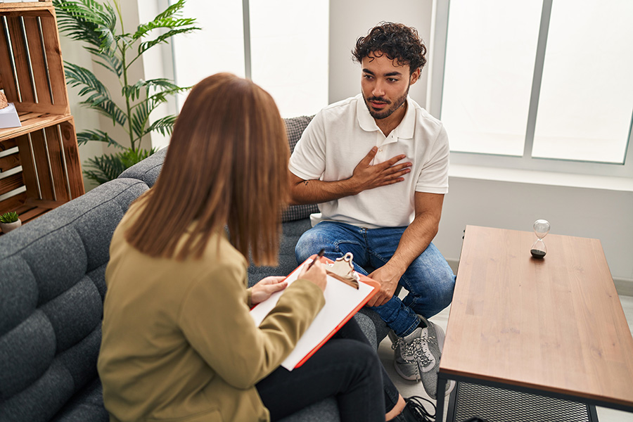 Man sitting with therapist struggling with cultural identity in Beaverton