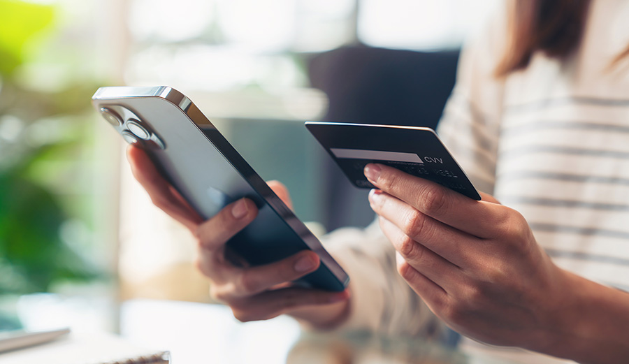 Person on phone impulsively purchasing and shopping