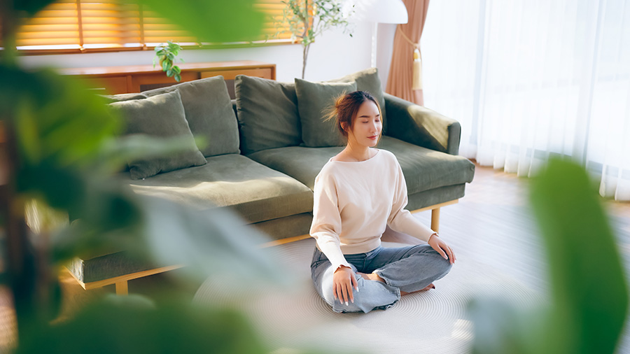 woman meditating inside her beaverton home